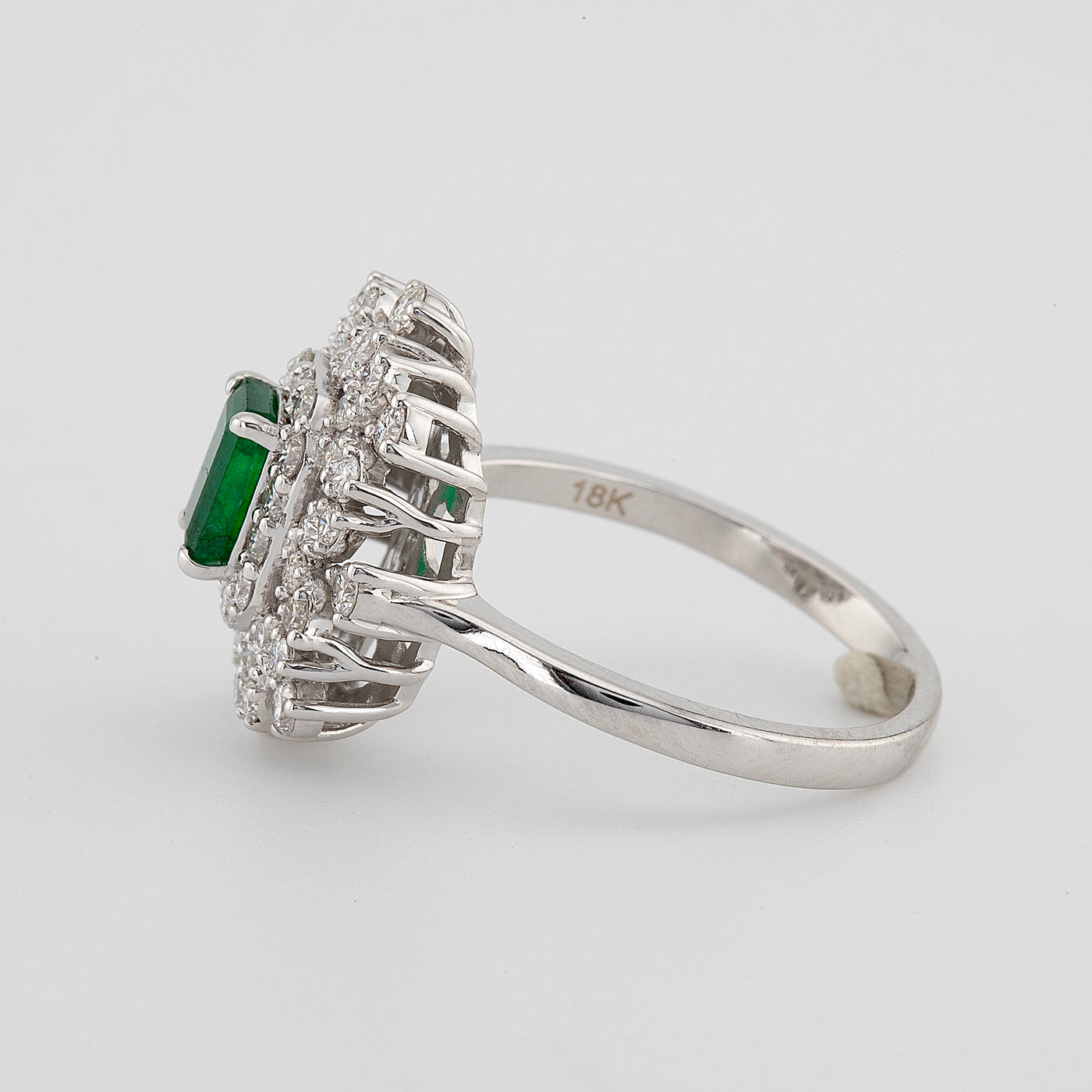Zambian Emerald cut green emerald color with white round diamond halo setting engagement ring