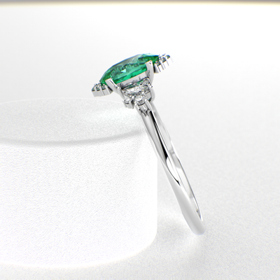 A Dazzling Trio: Green Oval Shape Emerald, Round, and Marquise Diamonds Setting New Trends