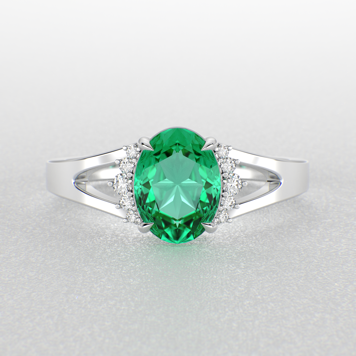 Gleaming Oval & Round Green Emerald Ring with Brilliant Sparkle