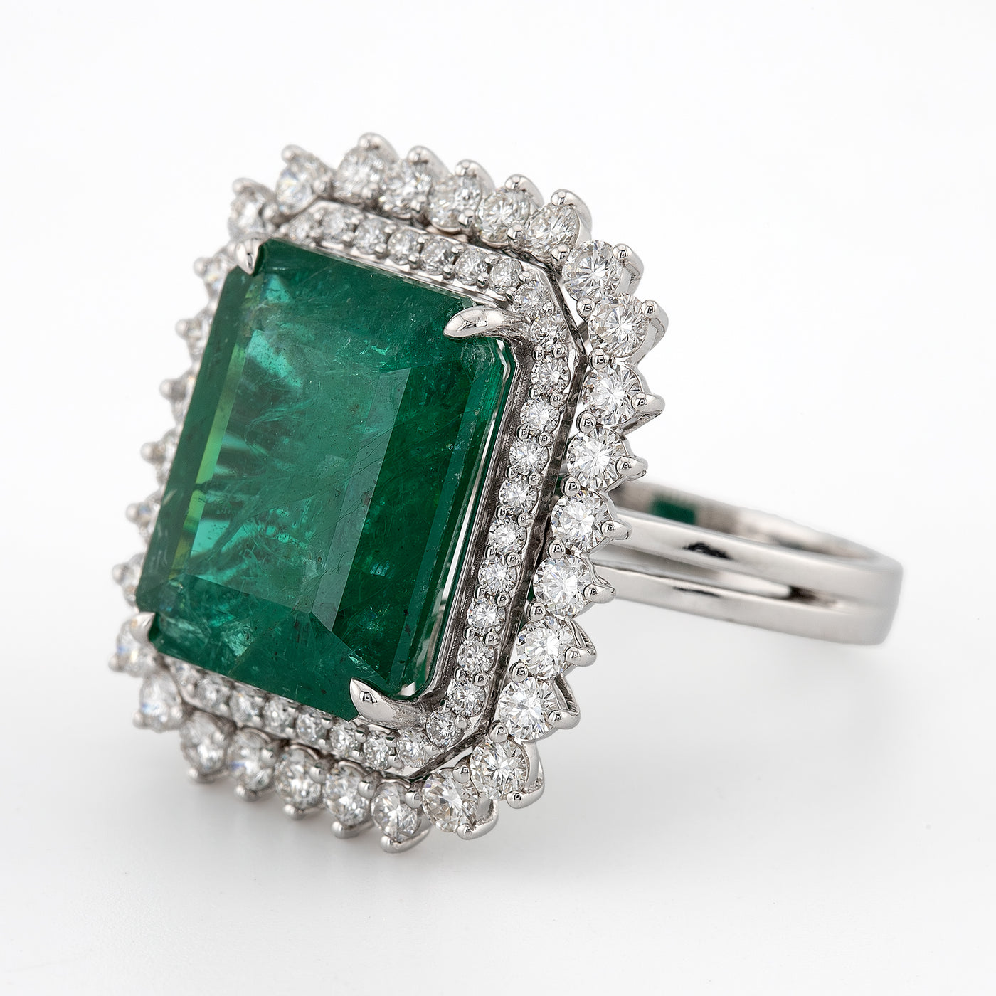Emerald shaped green emerald color with white diamond halo setting engagement ring