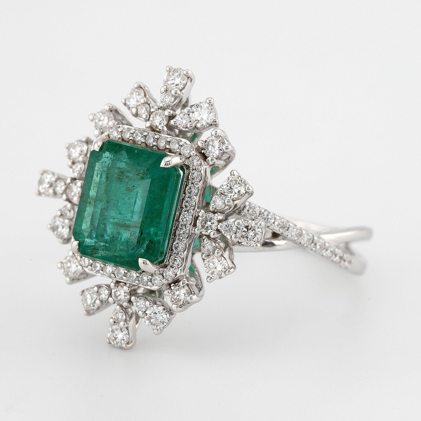 Vintage emerald shaped green emerald color with split shank, eagle prongs and halo setting engagement ring - Rubysta