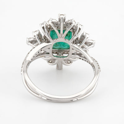 Vintage emerald shaped green emerald color with split shank, eagle prongs and halo setting engagement ring - Rubysta