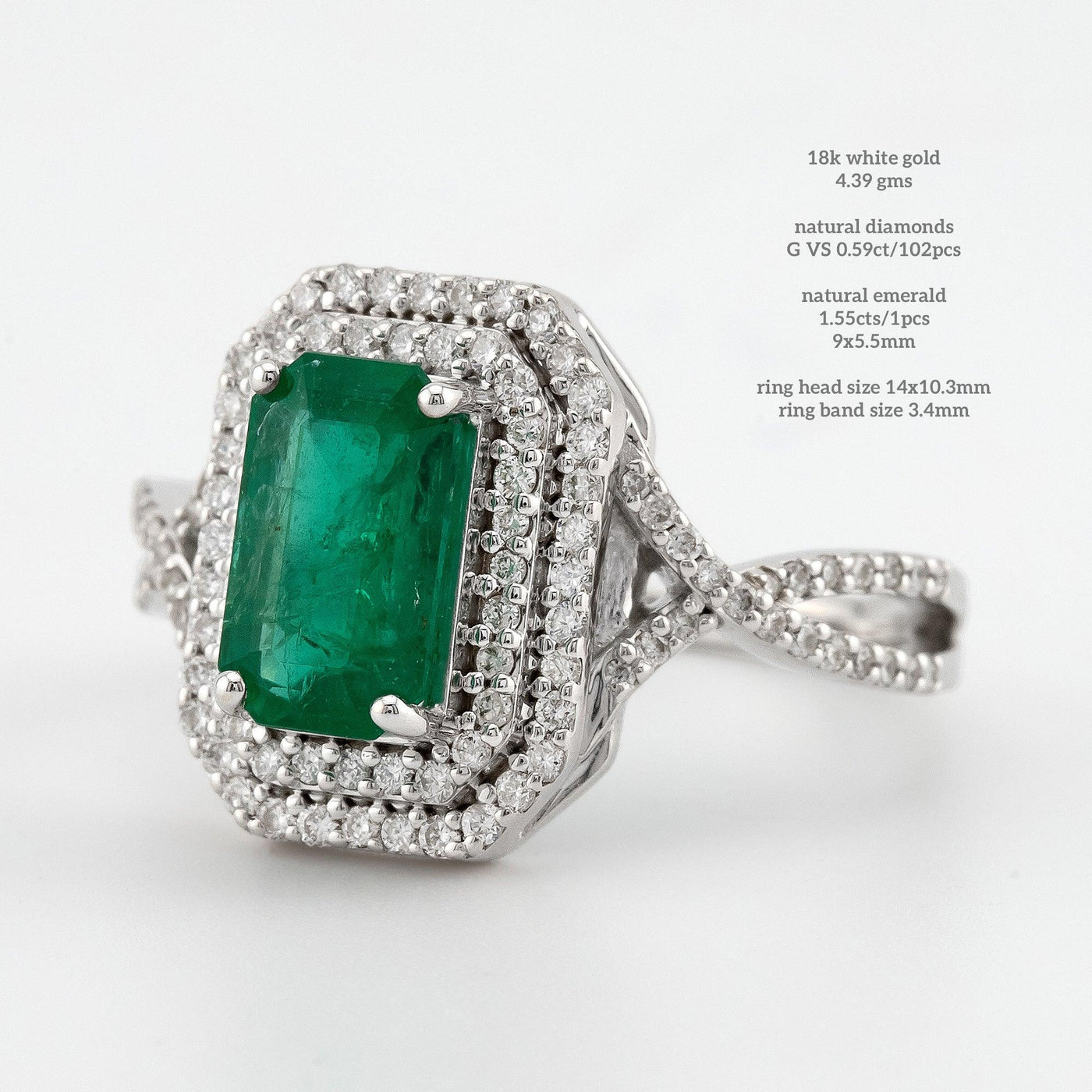 Emerald green color round prongs double halo setting engagement ring with twisted band - Rubysta
