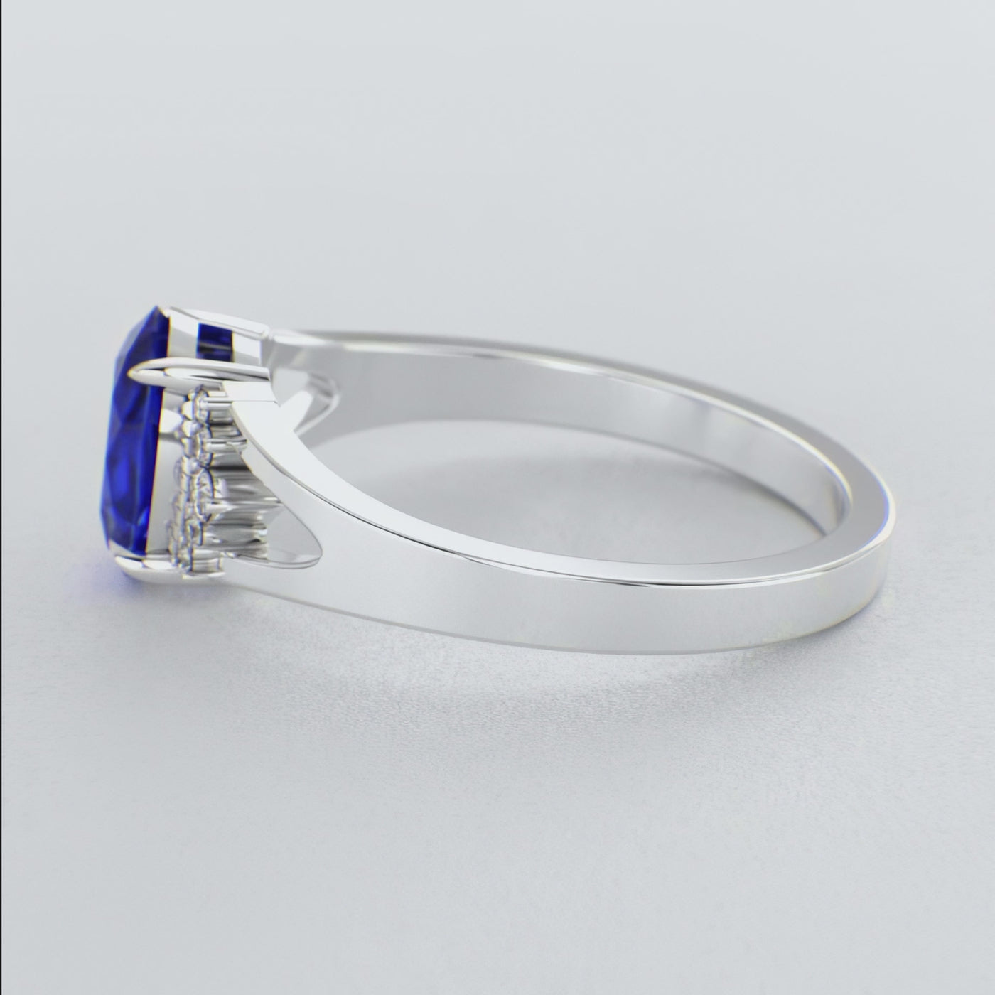 Gleaming Oval & Round Blue Sapphire Ring with Brilliant Sparkle