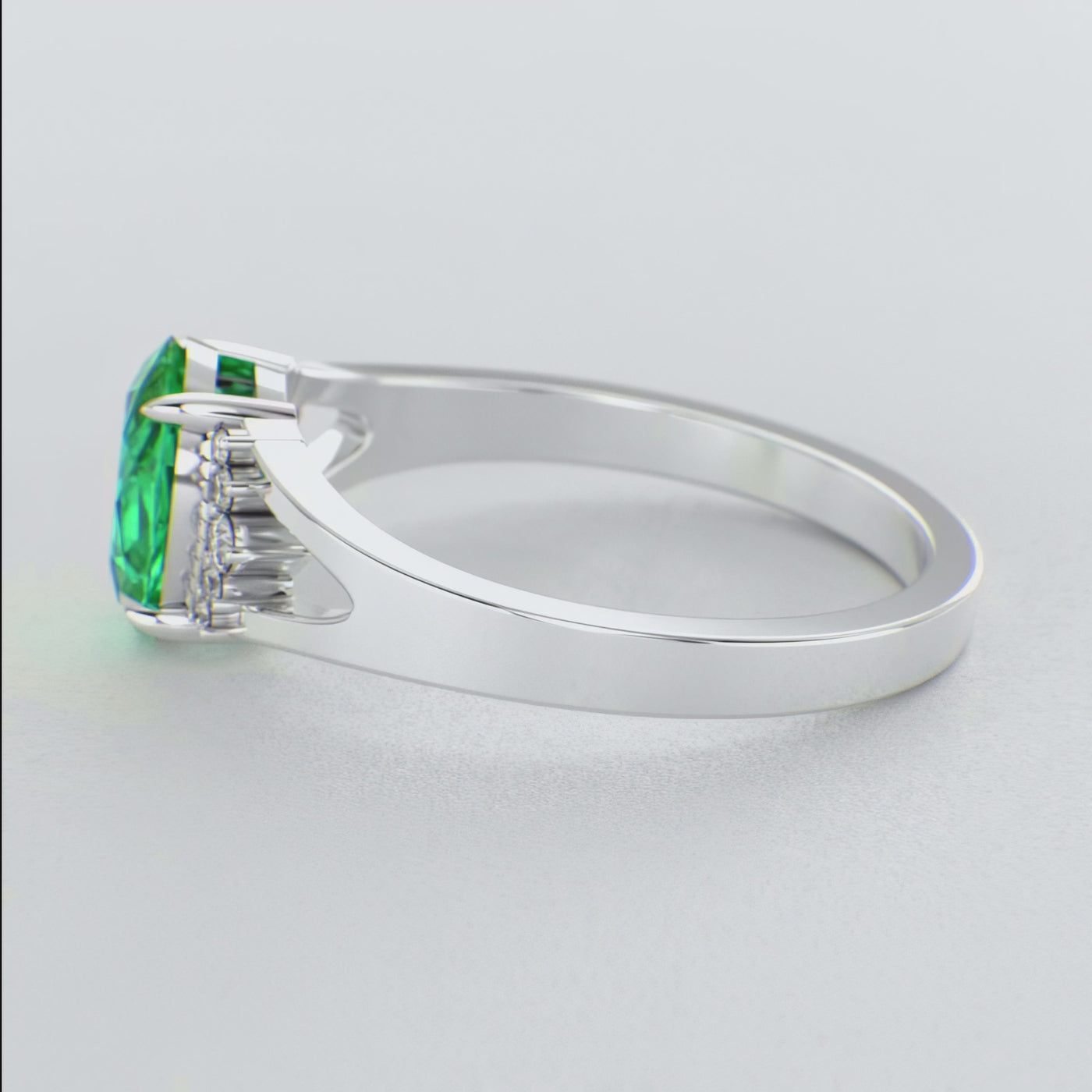 Gleaming Oval & Round Green Emerald Ring with Brilliant Sparkle